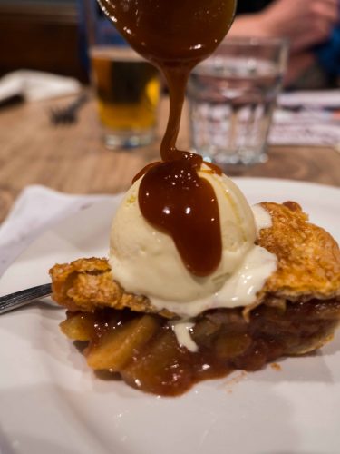 Apple pie with homemade ice cream and salted caramel sauce